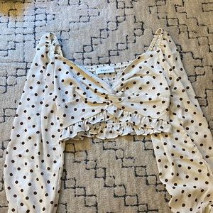 Cropped long sleeve polka dot top